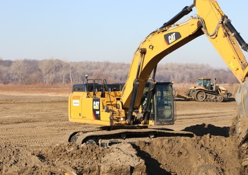 Hydraulic excavator on the L-594 levee