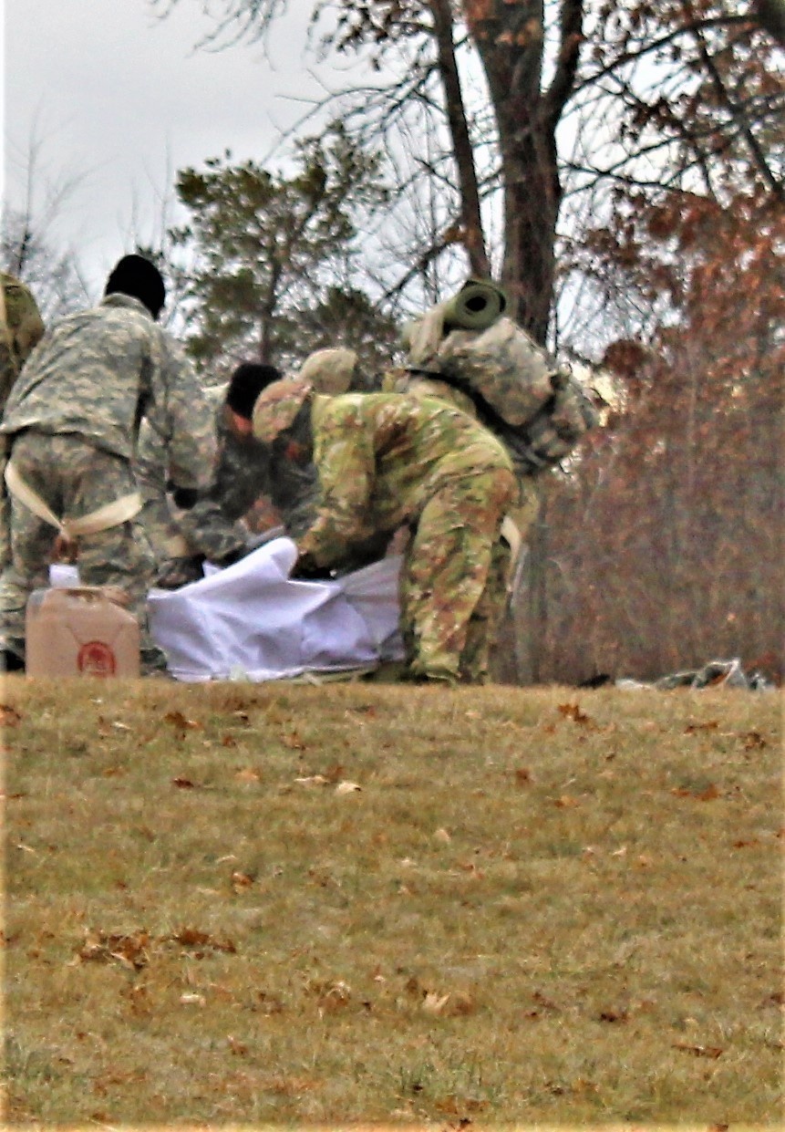 Cold-Weather Operations Course students practice building Arctic tent