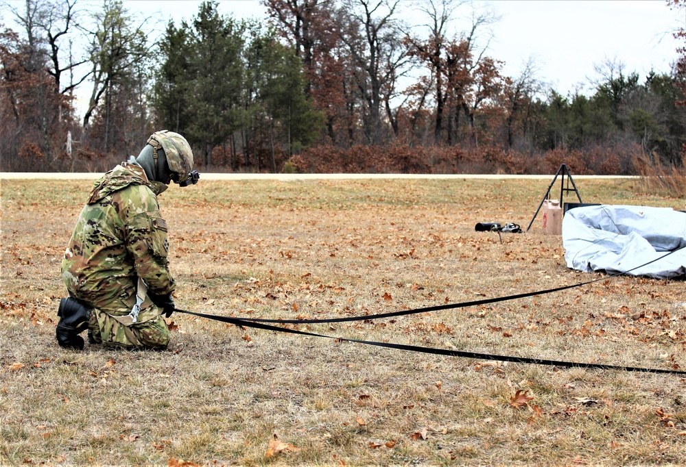 Cold-Weather Operations Course students practice building Arctic tent