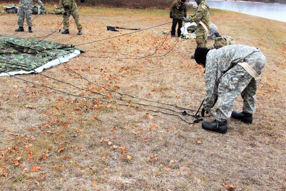 Cold-Weather Operations Course students practice building Arctic tent