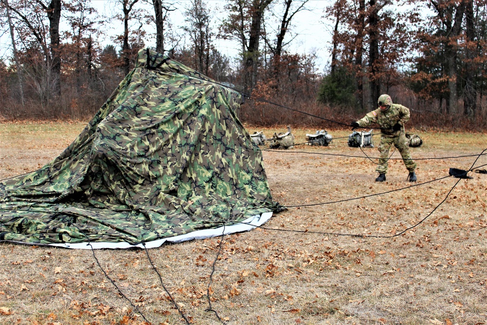 Cold-Weather Operations Course students practice building Arctic tent