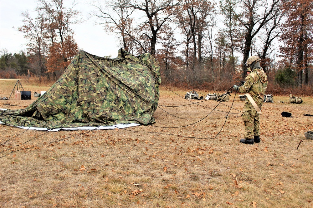 Cold-Weather Operations Course students practice building Arctic tent