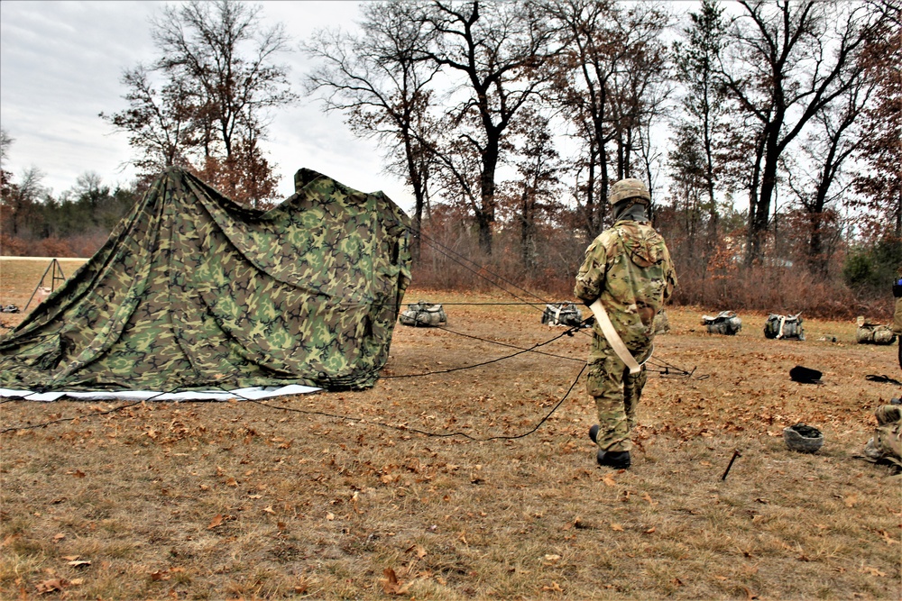 Cold-Weather Operations Course students practice building Arctic tent