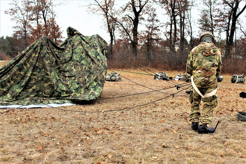 Cold-Weather Operations Course students practice building Arctic tent