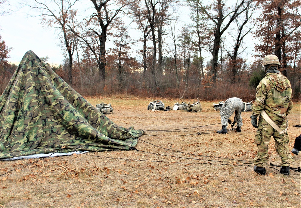 Cold-Weather Operations Course students practice building Arctic tent