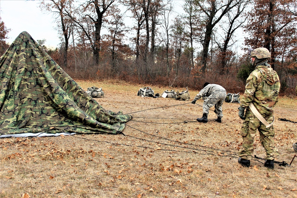 Cold-Weather Operations Course students practice building Arctic tent