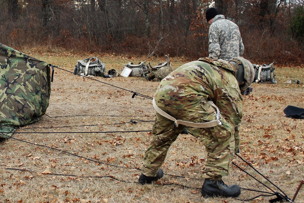 Cold-Weather Operations Course students practice building Arctic tent