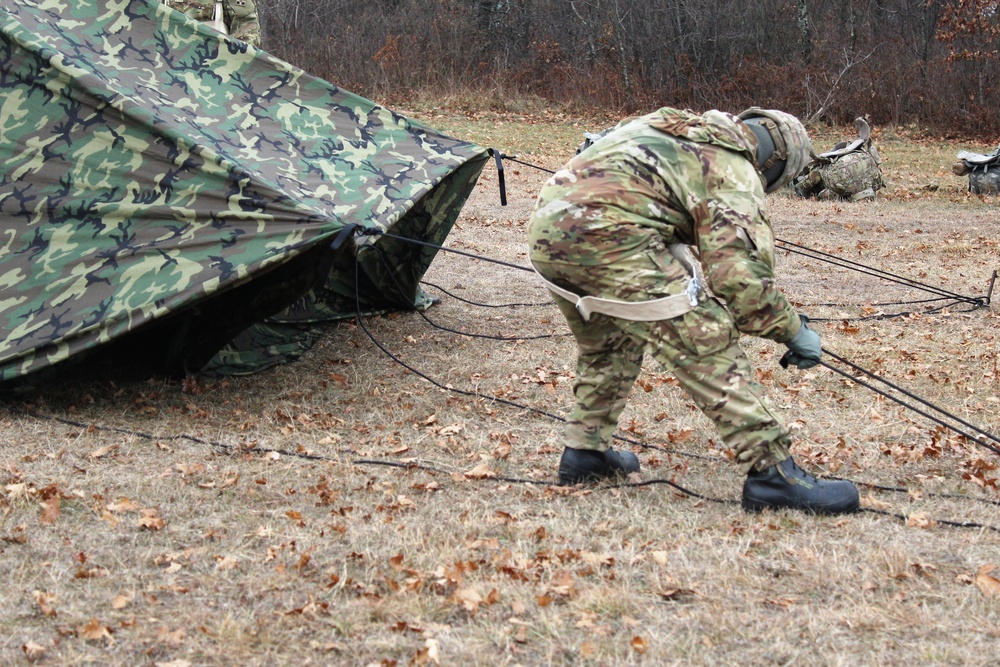 Cold-Weather Operations Course students practice building Arctic tent