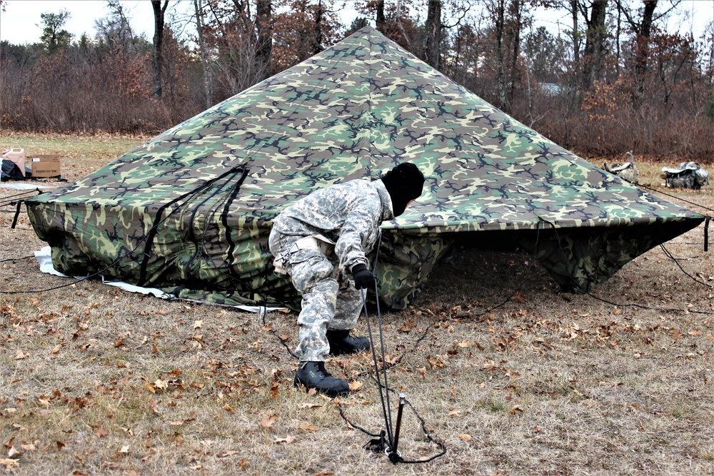 Cold-Weather Operations Course students practice building Arctic tent