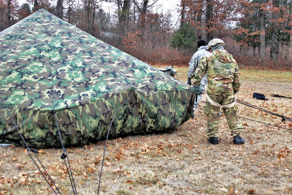 Cold-Weather Operations Course students practice building Arctic tent