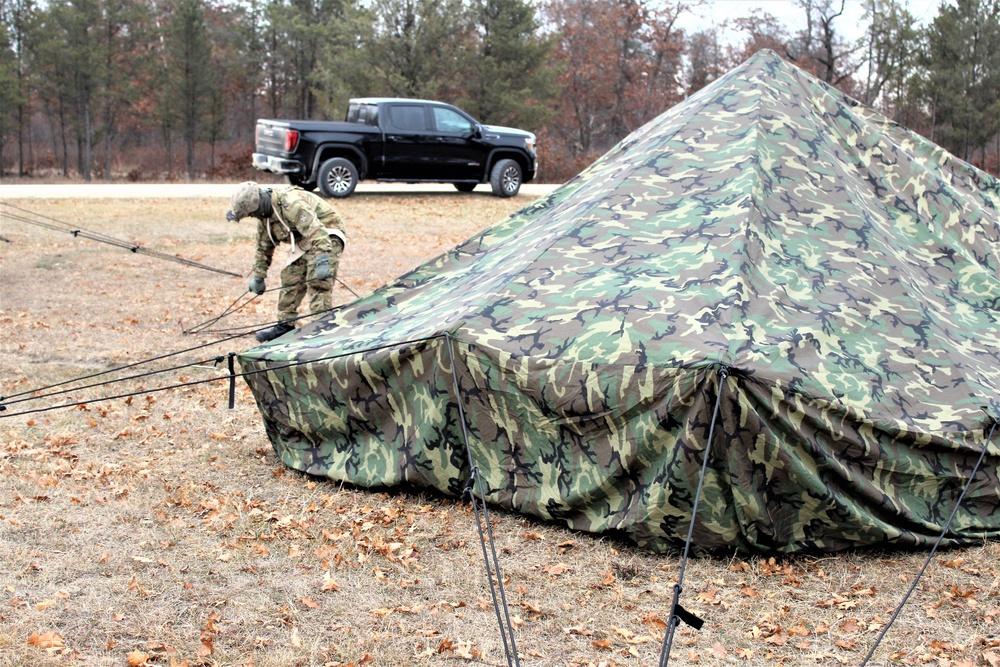 Cold-Weather Operations Course students practice building Arctic tent