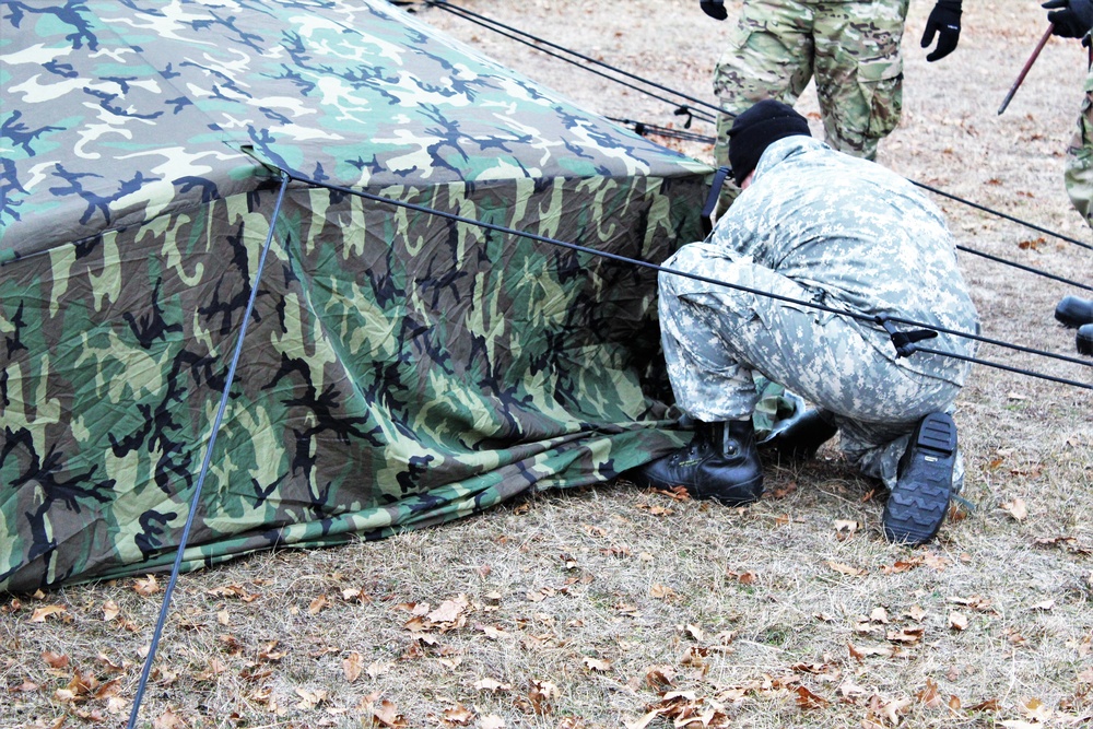 Cold-Weather Operations Course students practice building Arctic tent