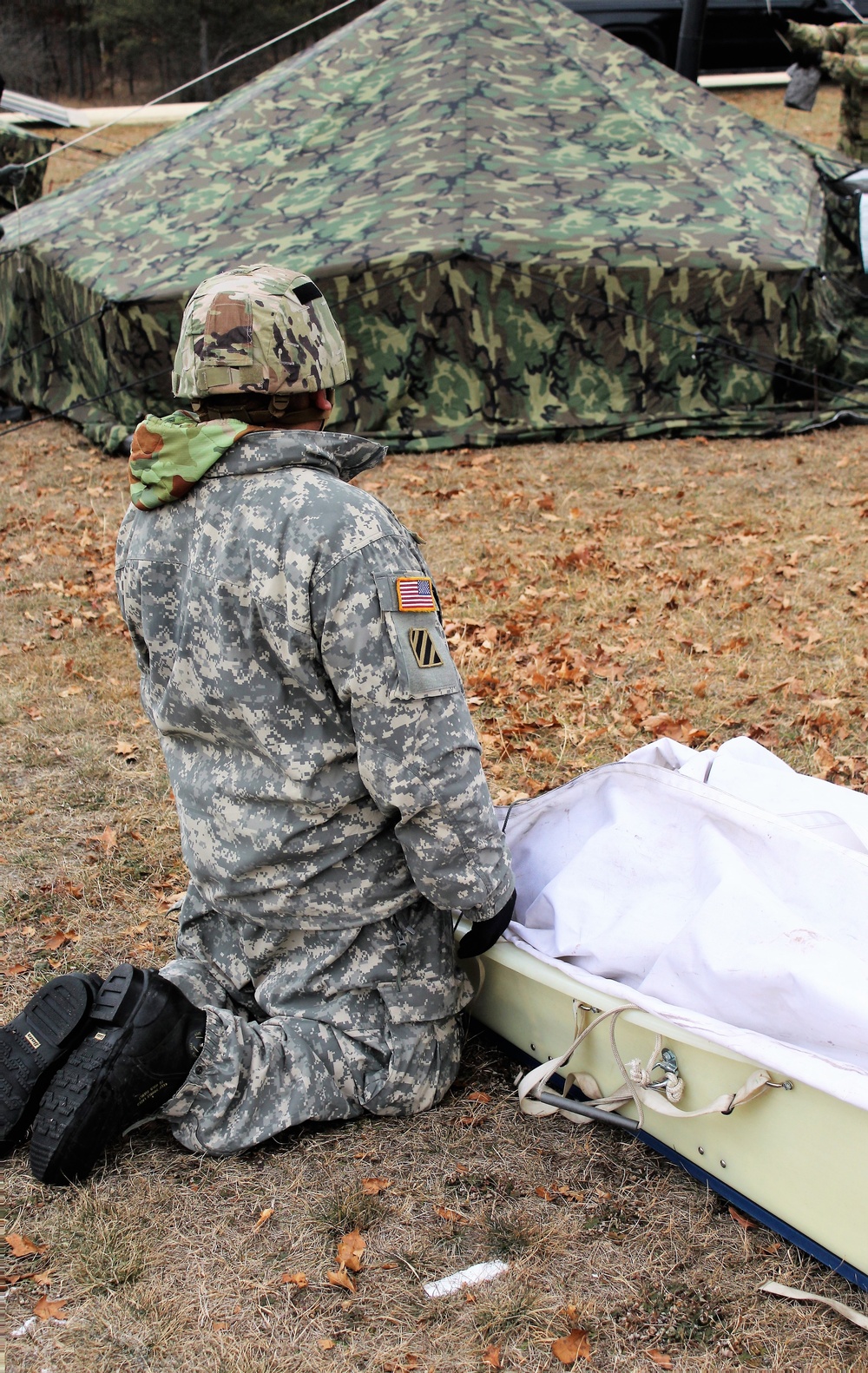 Cold-Weather Operations Course students practice building Arctic tent