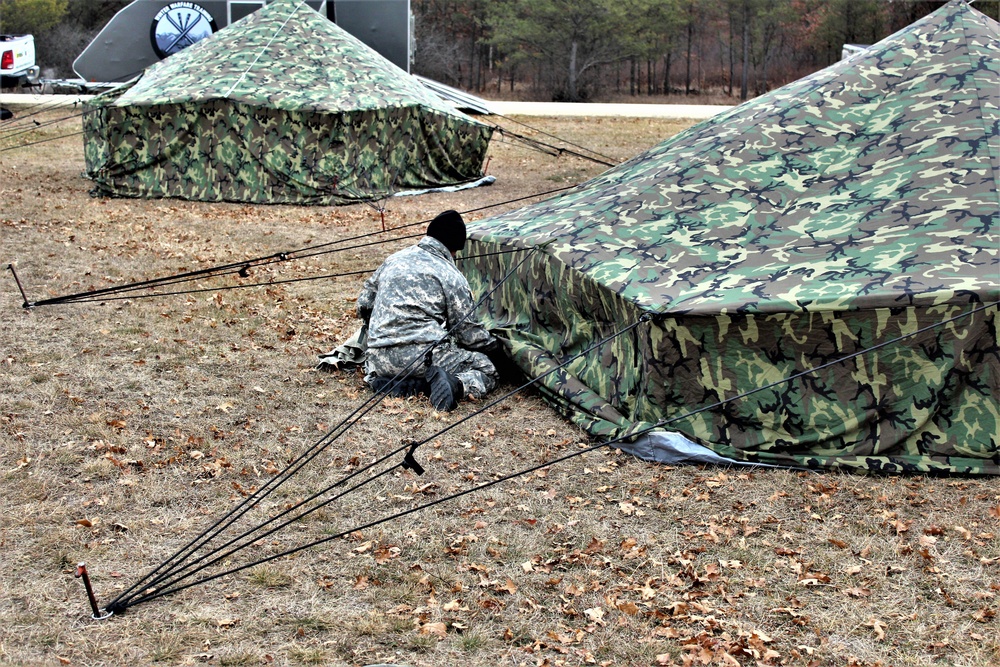 Cold-Weather Operations Course students practice building Arctic tent