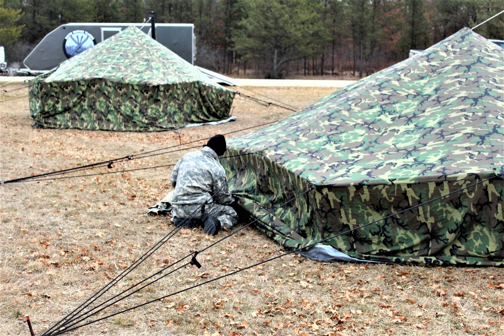 Cold-Weather Operations Course students practice building Arctic tent