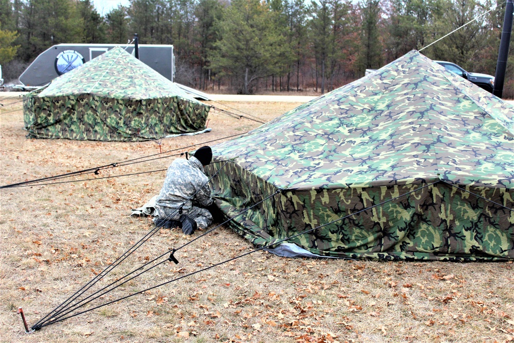 Cold-Weather Operations Course students practice building Arctic tent