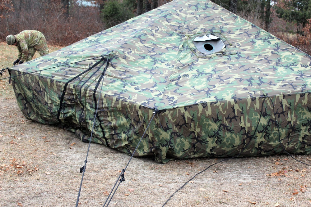 Cold-Weather Operations Course students practice building Arctic tent