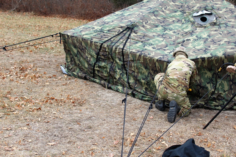 Cold-Weather Operations Course students practice building Arctic tent