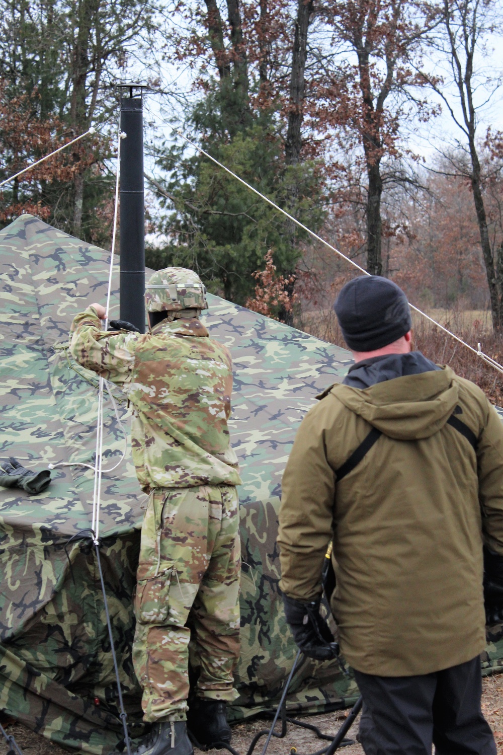 Cold-Weather Operations Course students practice building Arctic tent