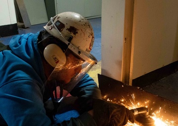 Contractor cuts metal.