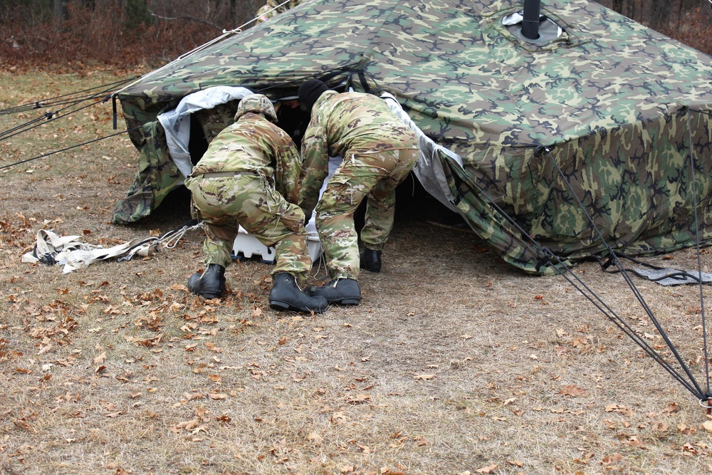 Cold-Weather Operations Course students practice building Arctic tent