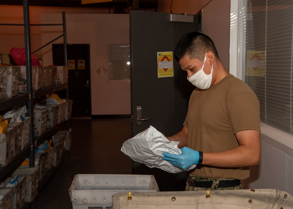 NAVSTA Rota Post Office Sorts Holiday Mail