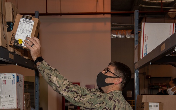 NAVSTA Rota Post Office Sorts Holiday Mail