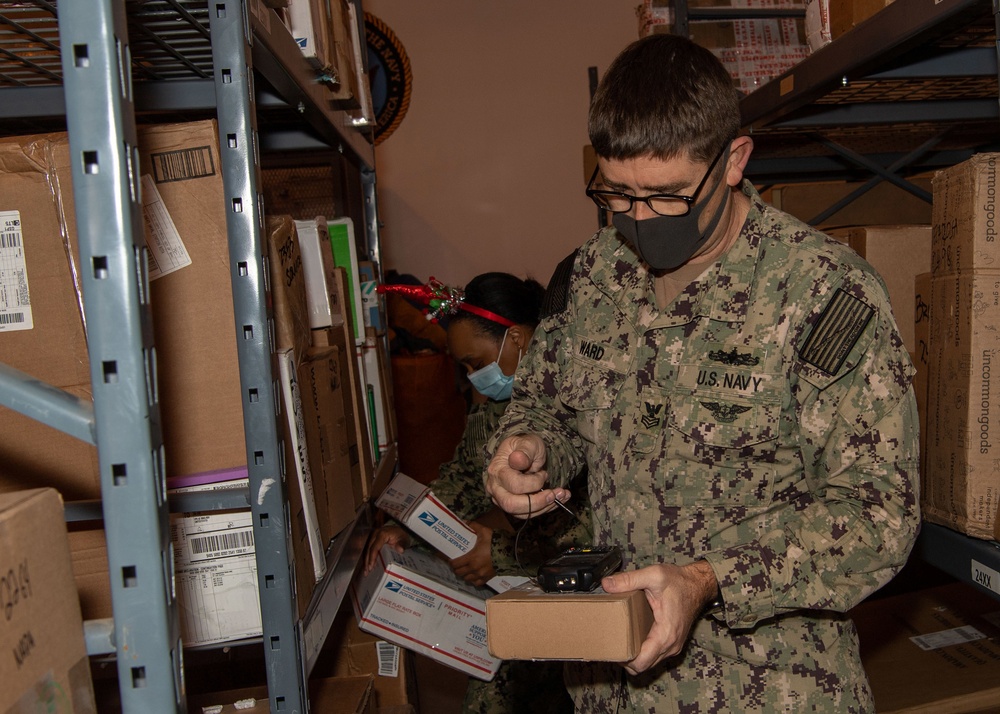 NAVSTA Rota Post Office Sorts Holiday Mail