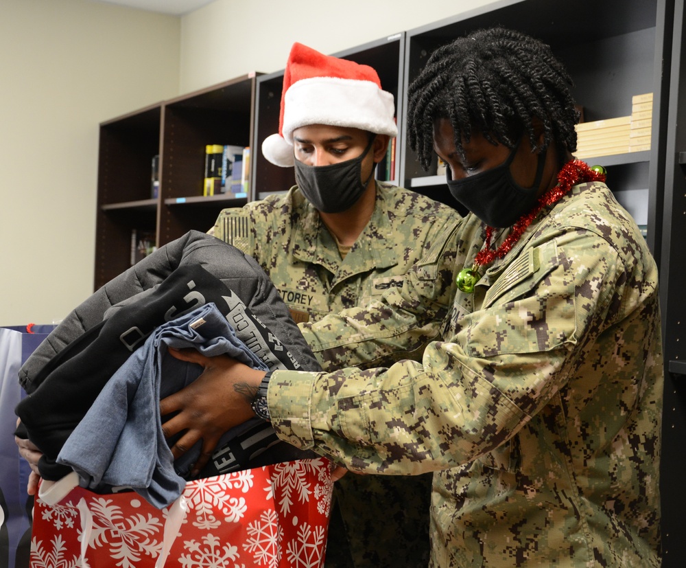 NSA Souda Bay Sailors Wrap Presents for a Holiday Gift Donation