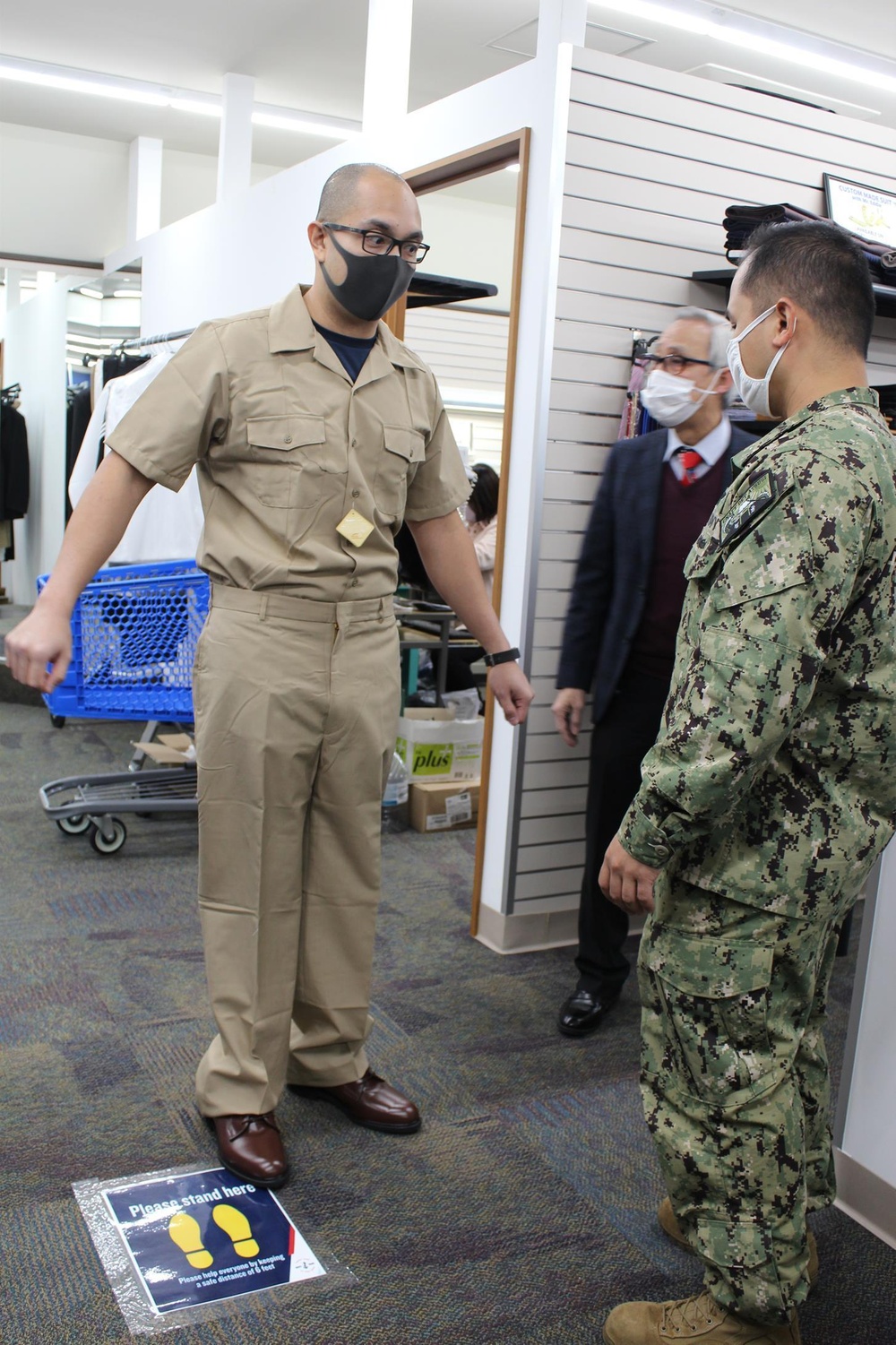 Chief Petty Officer Selectees Safely Get Fitted for their New Uniforms