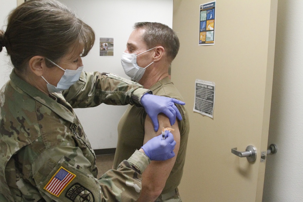 Arizona National Guard State Surgeon, Colonel Tom Leeper receives the first Moderna vaccine in the state of Arizona