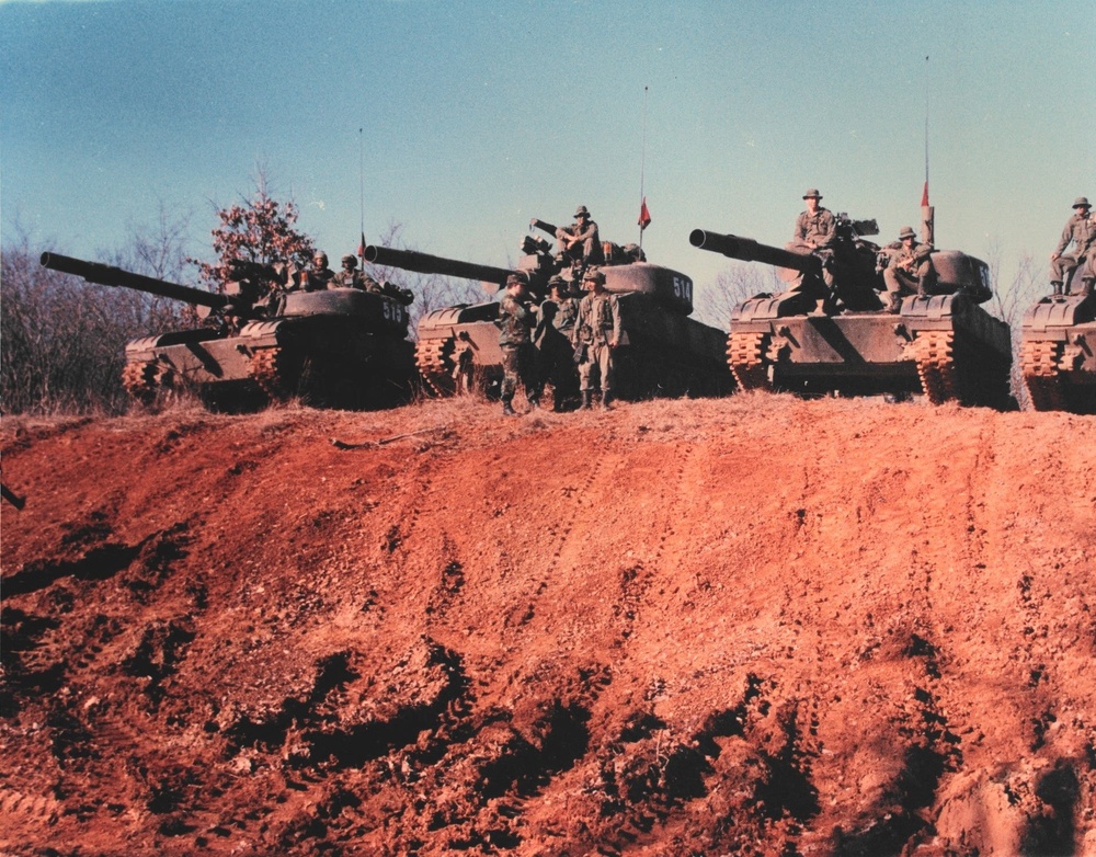 Three tanks in a line guarding red clay hill at JRTC in the late 1980's at JRTC