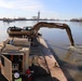 Kansas City District track-hoe with hydrodynamic dredge attached