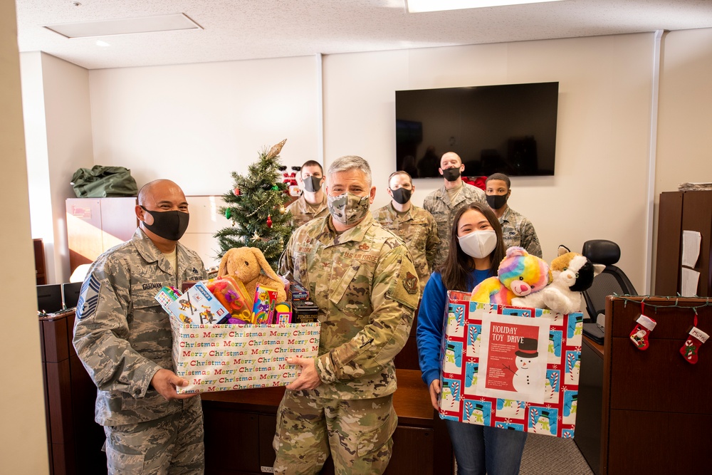 The 374th MXG delivers cheer to local community