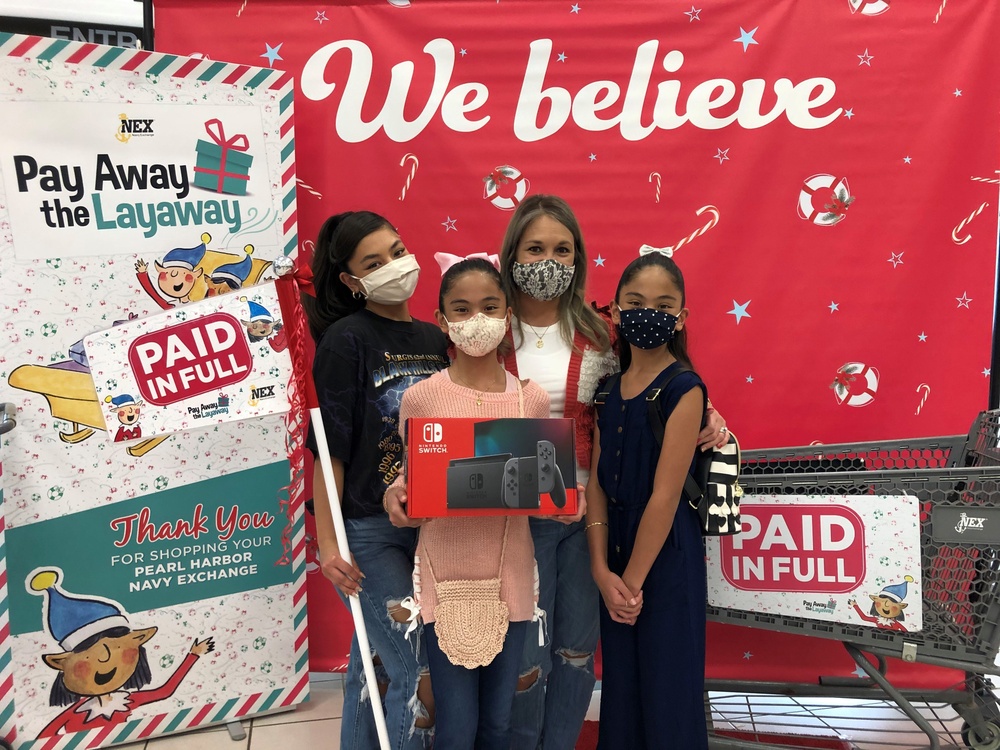NEX Customers Receive Holiday Surprise, Have Layaways Paid Off