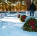 Volunteers placed wreaths on veterans graves