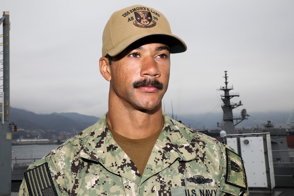 Sailor Poses for Portrait Aboard USS Emory S. Land in Kure