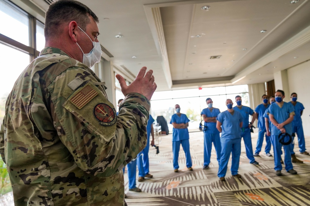 Airmen from 673rd Medical Group Collect Samples from USS Theodore Roosevelt Sailors for COVID-19 Testing