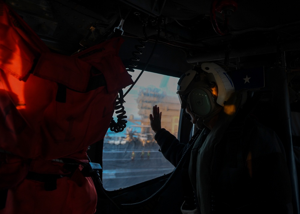 Rear Admiral Waves From Helicopter
