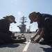 Nimitz Sailors Change Light On Flight Deck