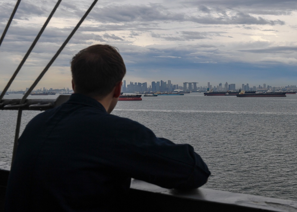 A Sailor looks out at Singapore