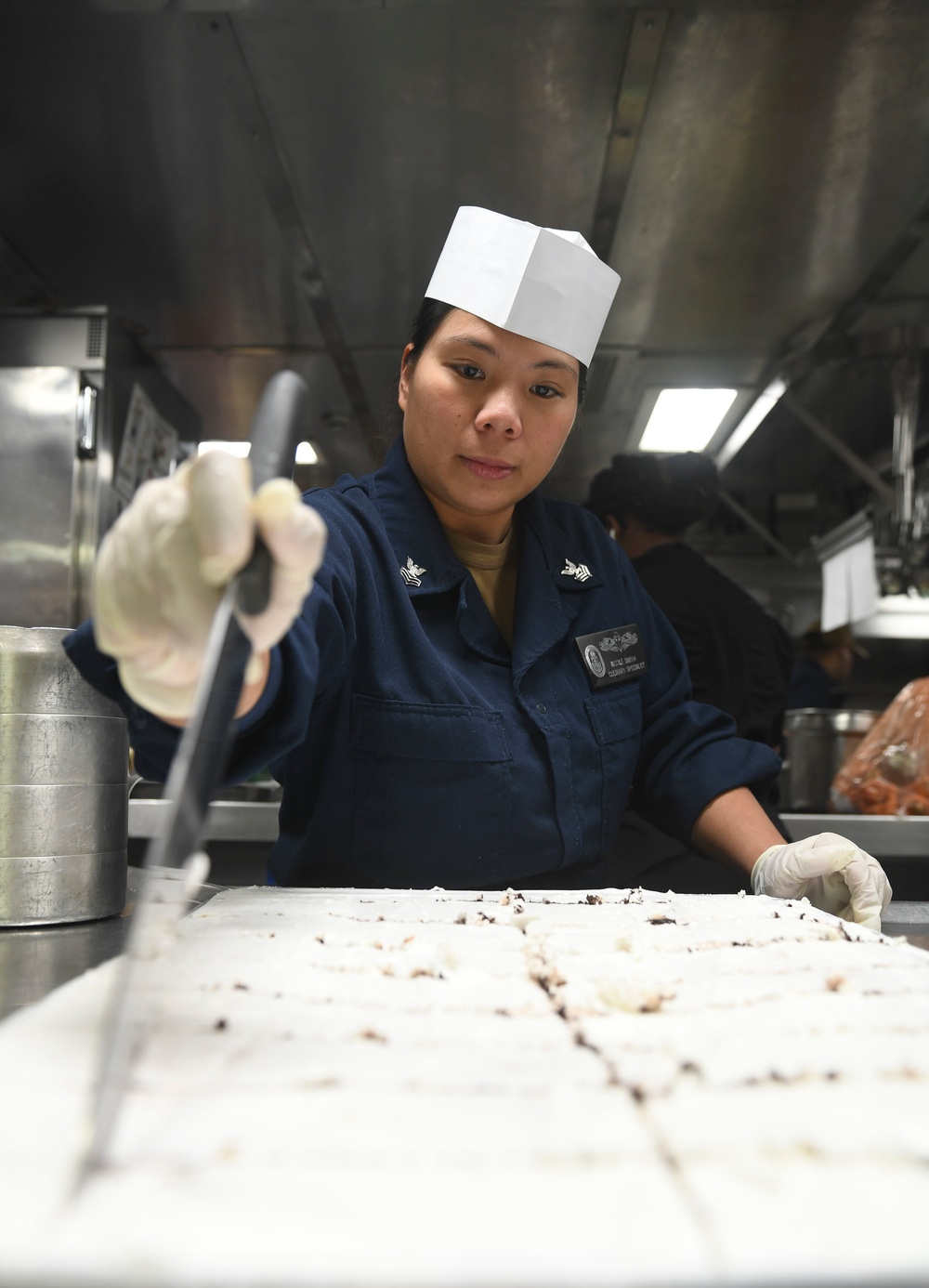 USS Princeton Sailor Cuts A Cake