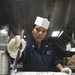 USS Princeton Sailor Cuts A Cake