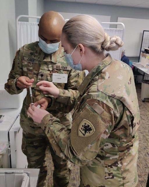Michigan National Guard CVTT administer COVID-19 vaccines in local hospital