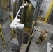 Paint robot applying paint to an MK82 general-purpose bomb body at McAlester Army Ammunition Plant