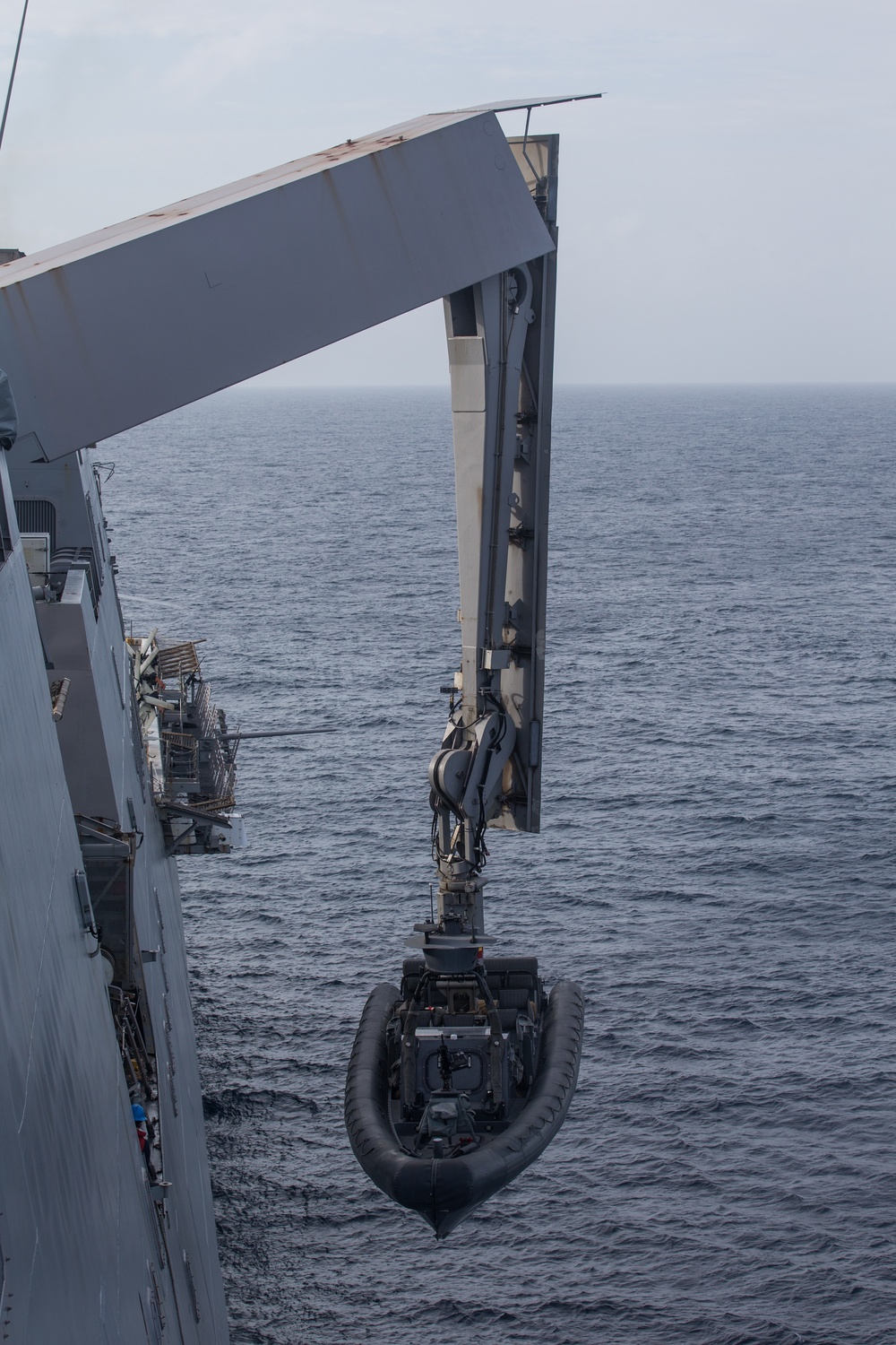 ADR Detachment Marines, USS Somerset Sailors, work together to launch RHIBs for a small boat training operation