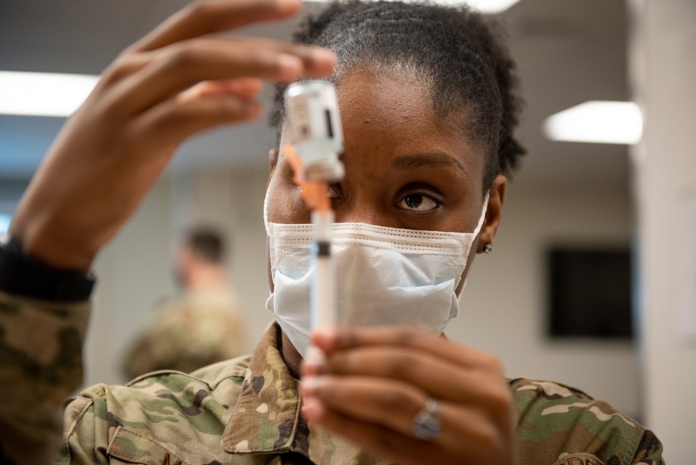 374th MDG administers initial COVID-19 vaccines