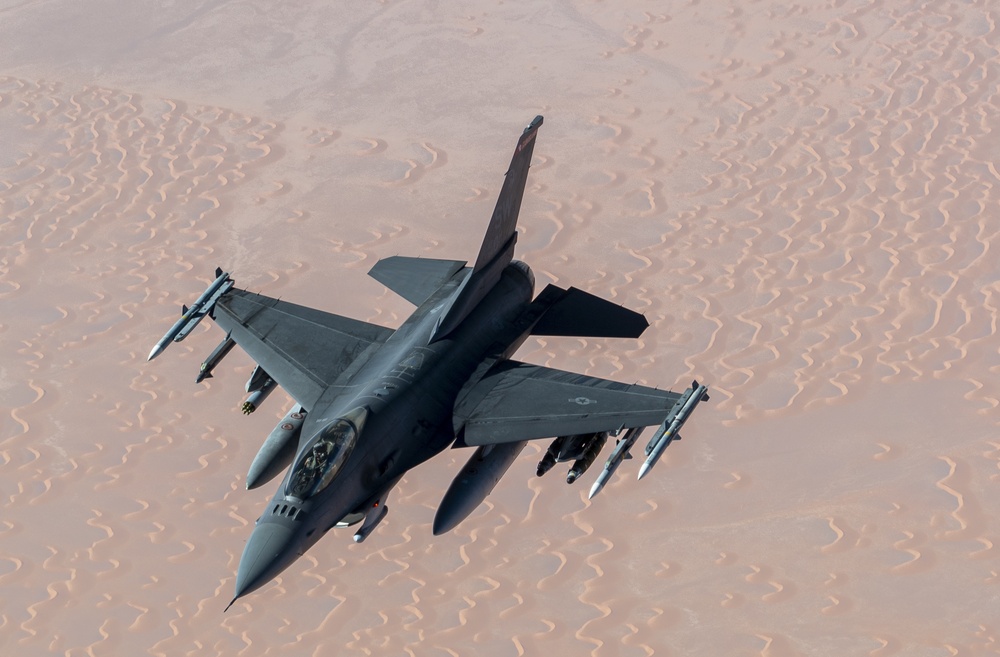 B-52 Stratofortress and F-16 Fighting Falcon fly over U.S. Central Command
