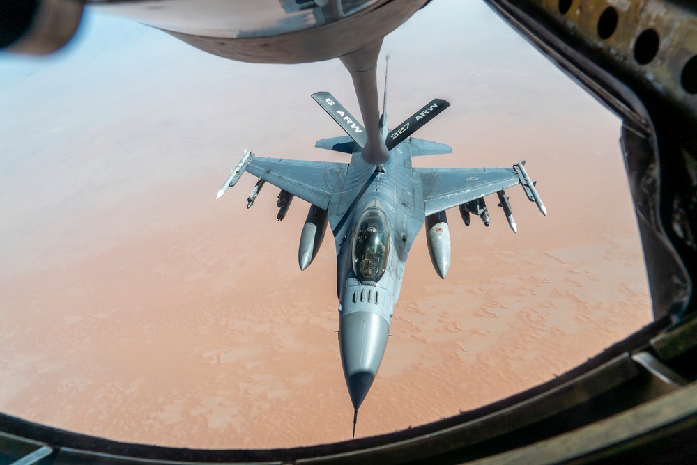 B-52 Stratofortress and F-16 Fighting Falcon fly over U.S. Central Command