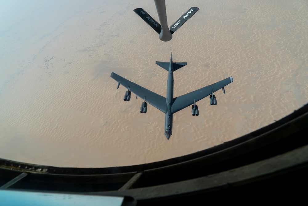 B-52 Stratofortress and F-16 Fighting Falcon fly over U.S. Central Command